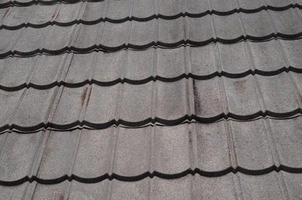 Stone-coated steel panel texture close-up